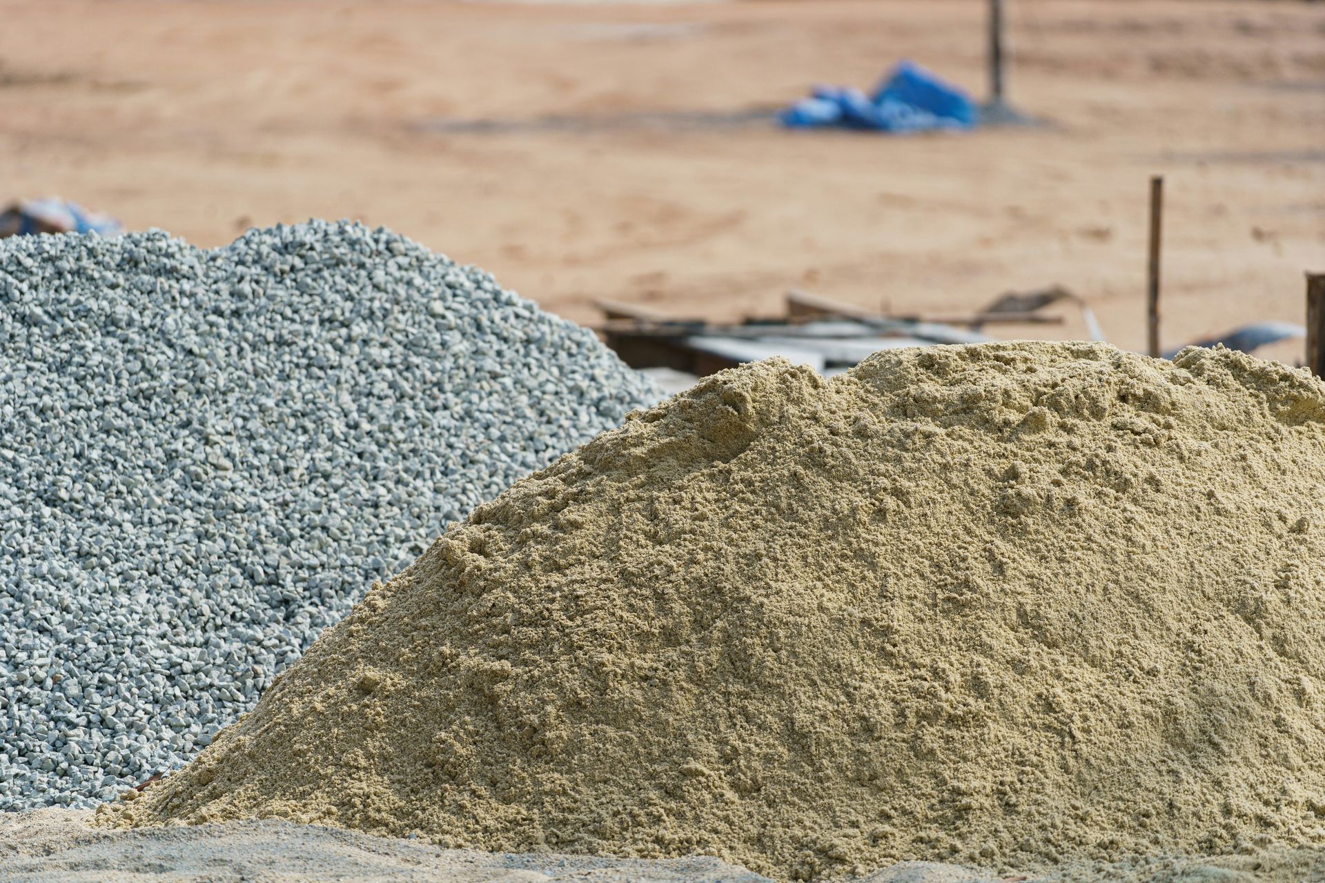 a pile of cement next to a pile of sand